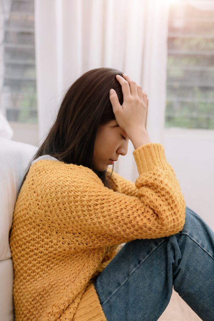 Depressed young woman coping with loss, grief, trauma.
